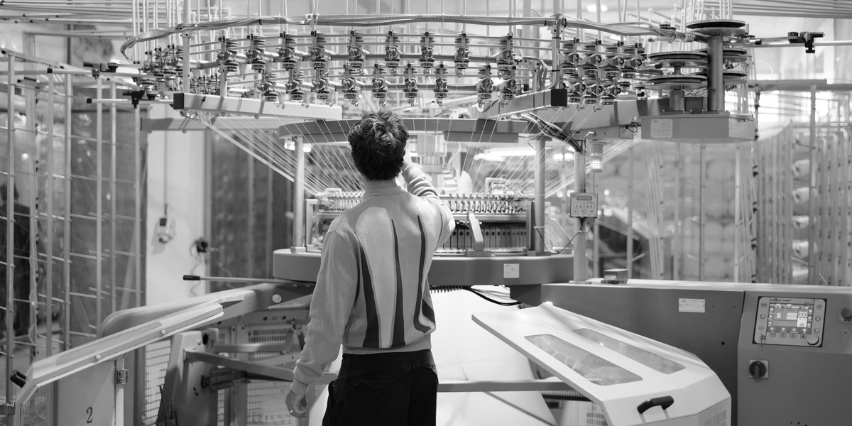 The LineryMerch workshop in Portugal: circular knitting machine and rolls of undyed jersey